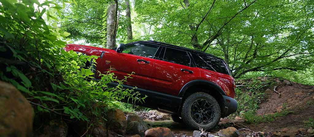 2026 Ford Bronco Sport® SUV with a Bronco Off-Roadeo®being driven up a rocky hill