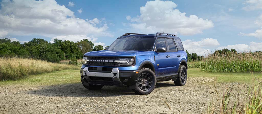 2026 Ford Bronco Sport® SUV parked on a gravel area with trees in the background