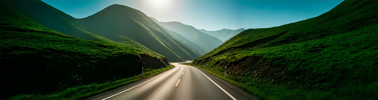 A road with mountains on both sides