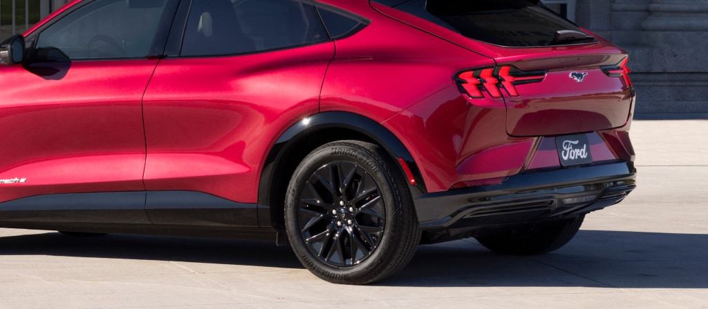 2025 Ford Mustang Mach-E® parked and highlighting the rear taillights