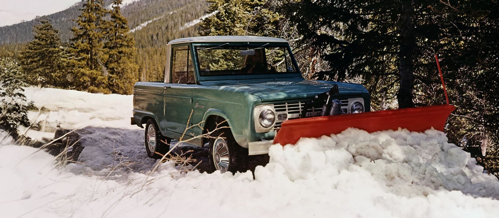 1960s Bronco Sport Utility with snowplough attachment.