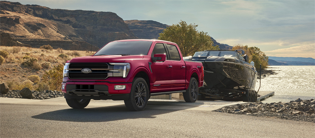 F-150 parked at water’s edge with a hitched boat.