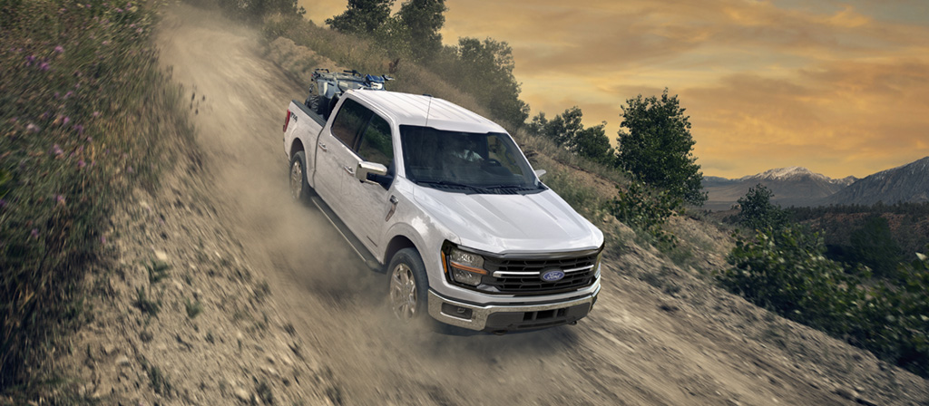 F-150 driving down a dirt slope.
