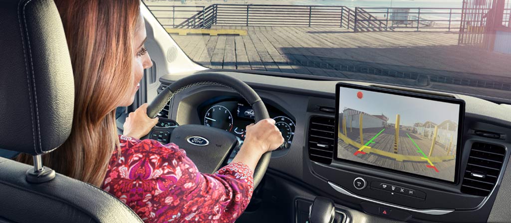 A person using the backup camera in the 2025 Ford Transit® Van