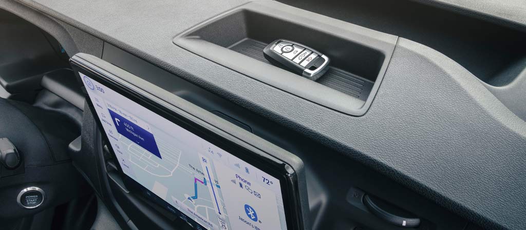 Close-up of the upper dashboard storage compartments in the 2025 Ford Transit® Van