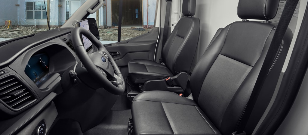 The interior of a 2026 Ford Transit® van driver's and passenger's seat