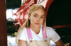 Close-up of Sydney Sweeney near a vintage Bronco® SUV
