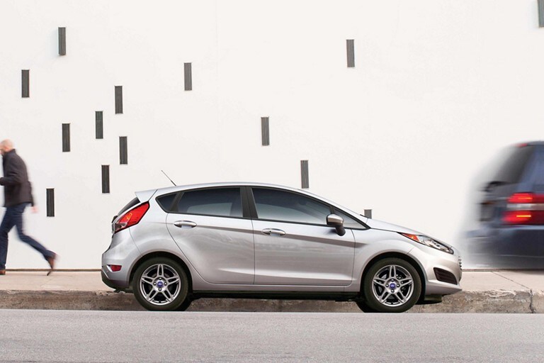 A Ford Fiesta parked at the curb