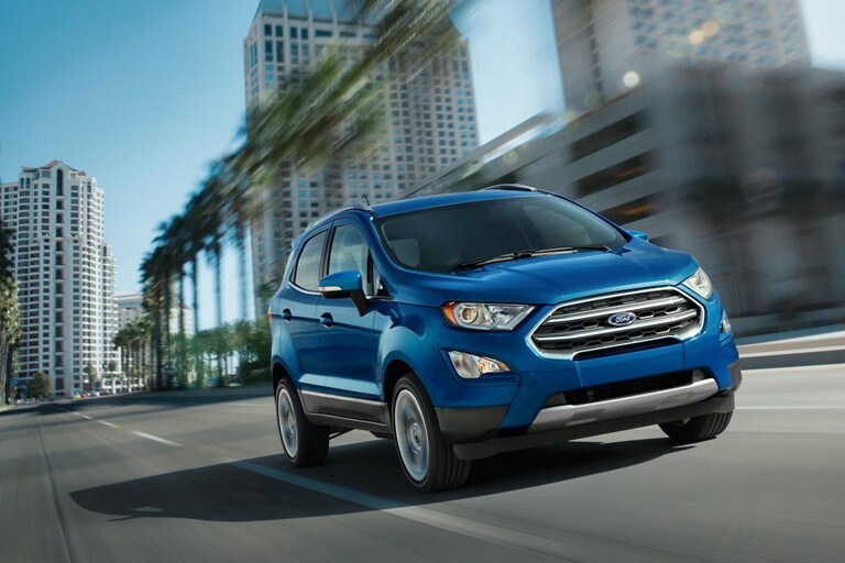 A Blue 2021 EcoSport driven on a city street