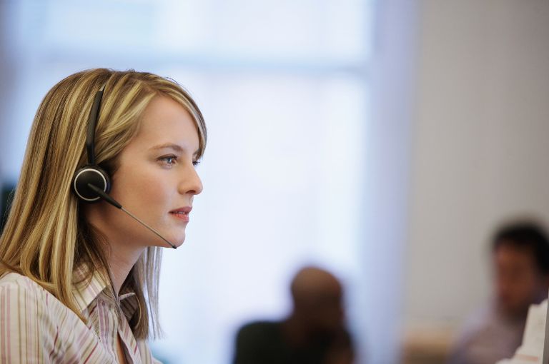 Young woman on duty at call center
