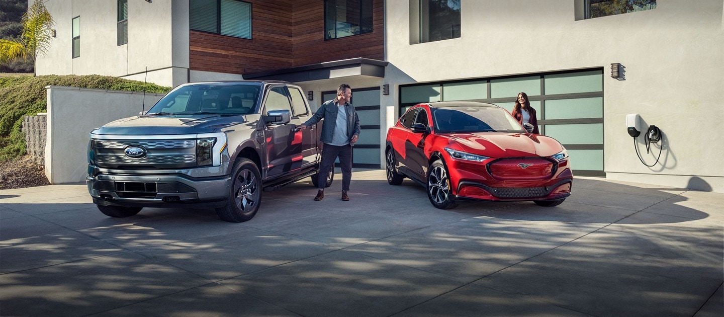 F-150 Lightning and Mustang Mach-E parked in a driveway.