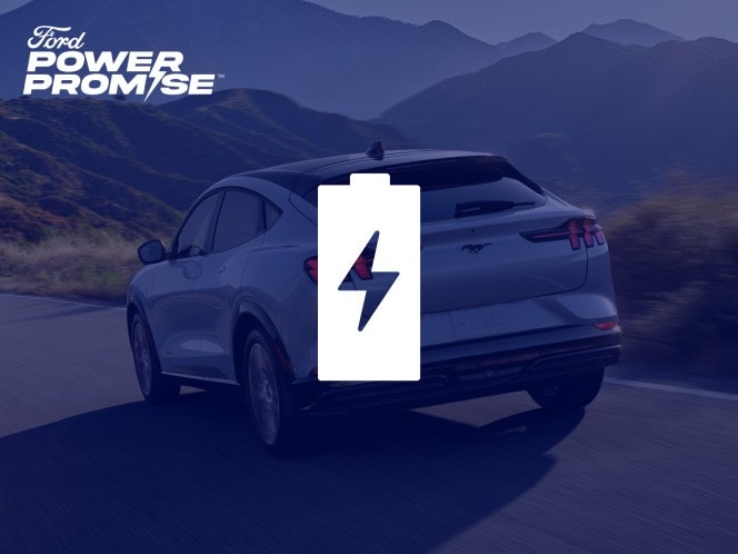 A Ford Mustang Mach-E driving down a road with mountains in the background with battery icon overlaid.