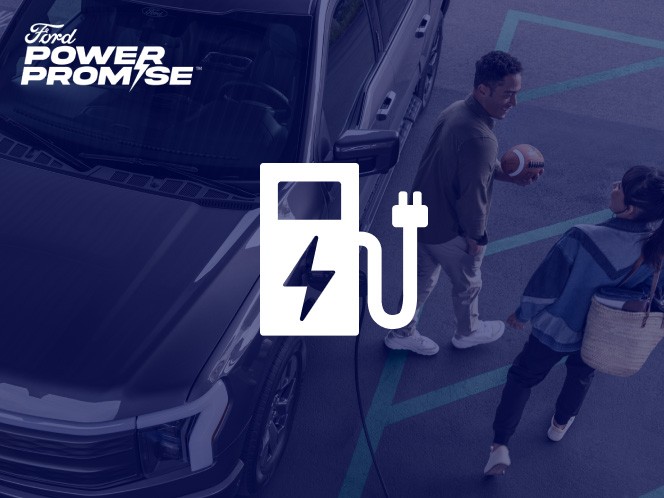 A couple walking away from their Ford F-150 Lightning charging in a parking lot with charging icon overlaid