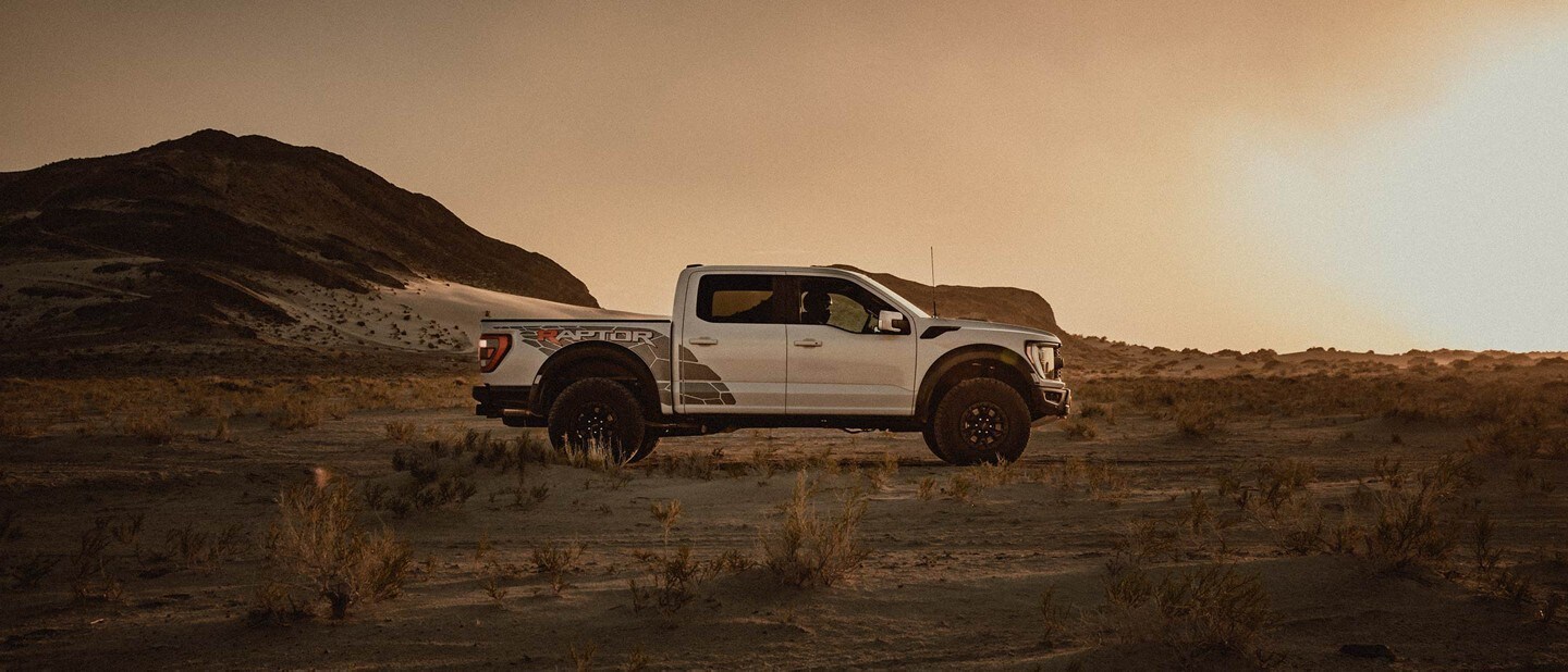 Side view of a Ford f 1 50 Raptor in a desert setting