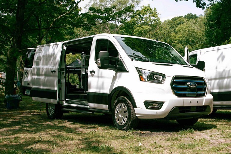 Three quarter view of a red Ford E-Transit