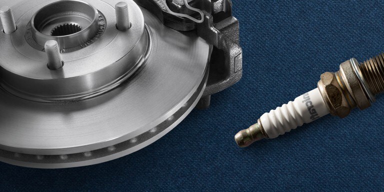 A spark plug and a brake disk