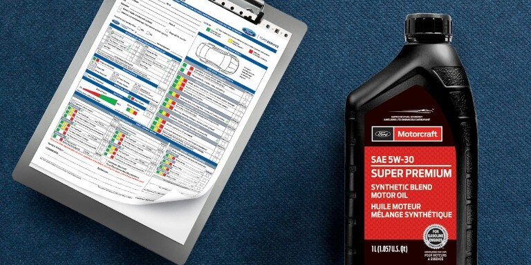 Vehicle report card and an oil bottle