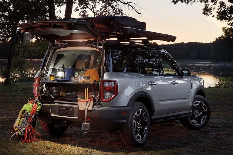 Cargo organizer loaded with camping gear at the back of the 2021 Bronco Sport in Iconic Silver