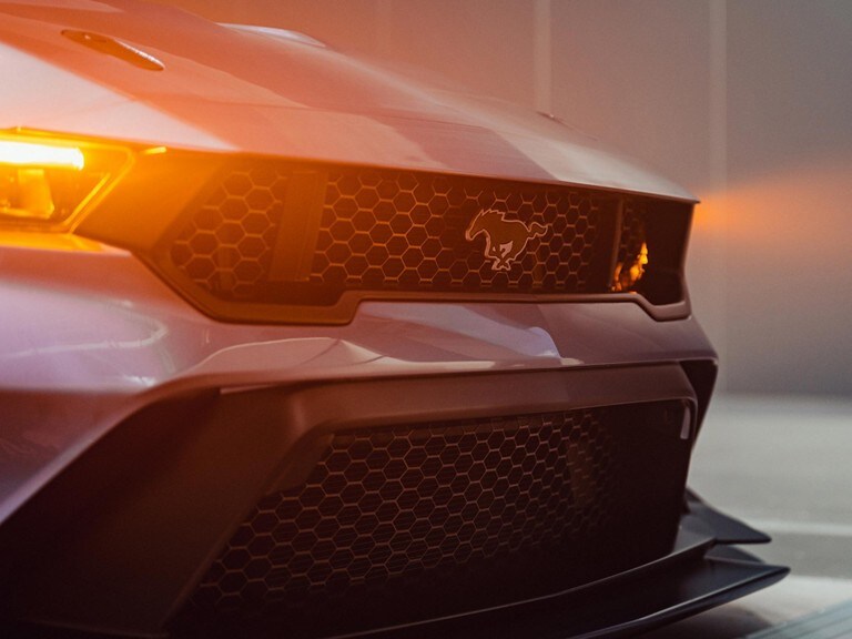 Side profile of a 2025 Mustang® GTD parked on a closed course.