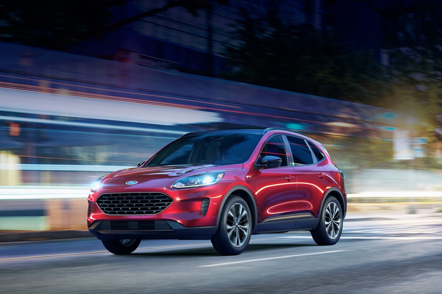 A 2022 Ford Escape on a city street at night