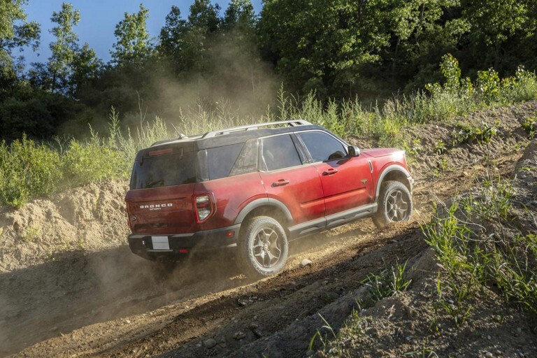 A Ford Bronco Sport up a sandy hill