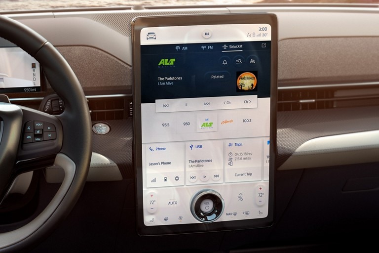 The interior of a Mustang Mach-E with SiriusXM displayed on the SYNC 4 system
