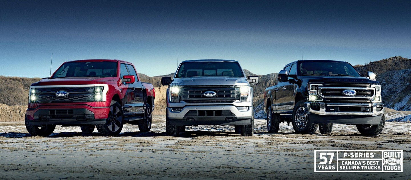 From left to right; a red, silver, and black F-150 trucks are lined up in a dessert setting with a 57-year badge on the bottom right corner