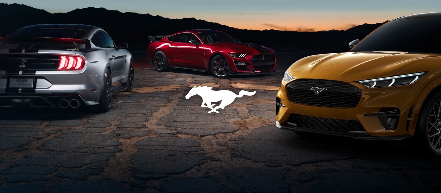 Three 2021 Ford® Mustangs parked in the mountains