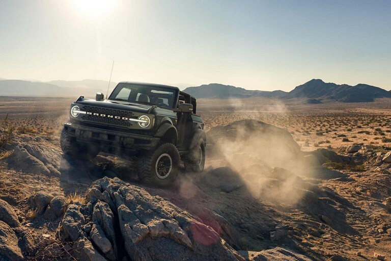 2024 Ford Bronco® model being driven over rocky desert terrain