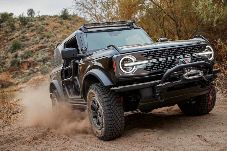 2024 Ford Bronco® Badlands™ in Shadow Black with heavy-duty modular front bumper shown