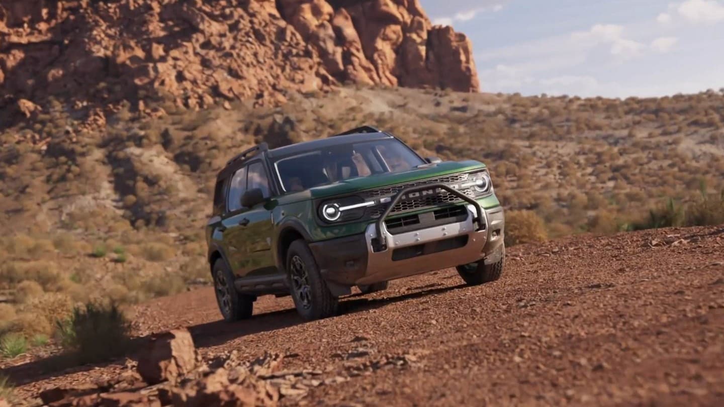 2025 Ford Bronco® Sport being driven over rocky terrain with boulders in the background