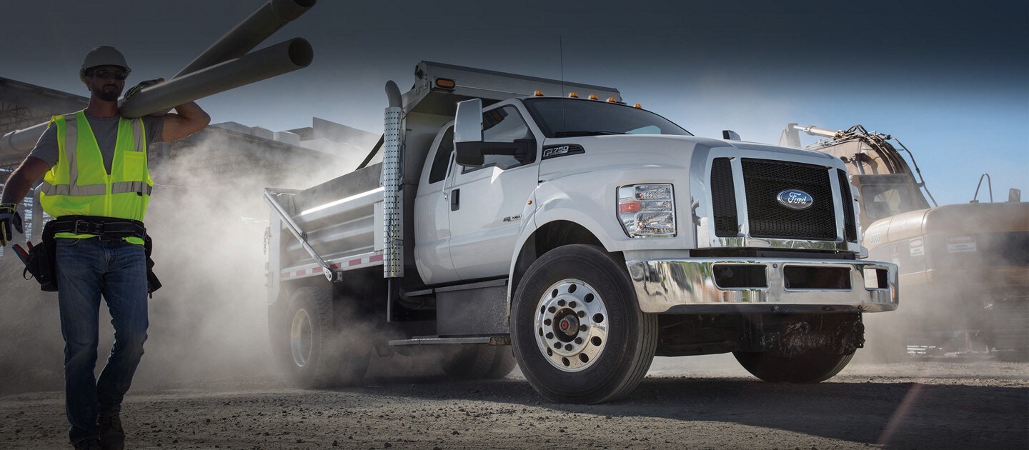 2024 Ford F-750 Diesel Super Cab in Oxford White with aftermarket dump equipment at a construction site