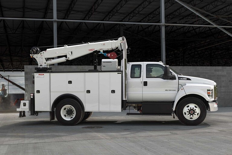 2024 Ford F-750 SuperCab in Oxford White with mechanic truck upfit parked at building site