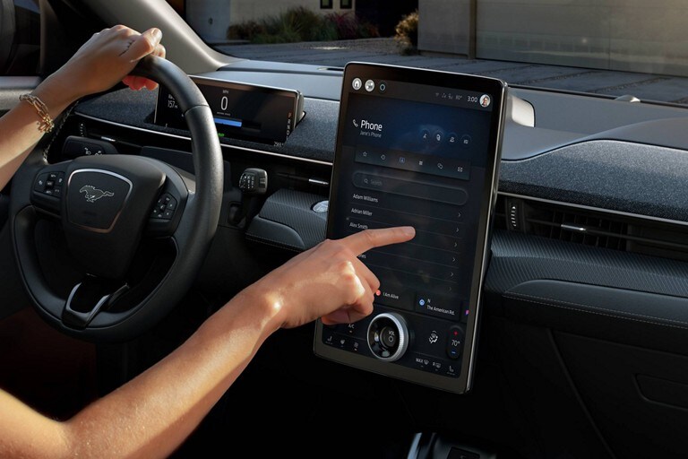 Person using the 15.5" touchscreen in the 2023 Ford Mustang Mach-E® SUV