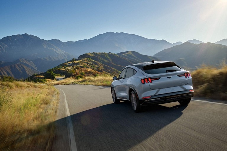 2024 Ford Mustang Mach-E® being driven on a scenic mountain highway
