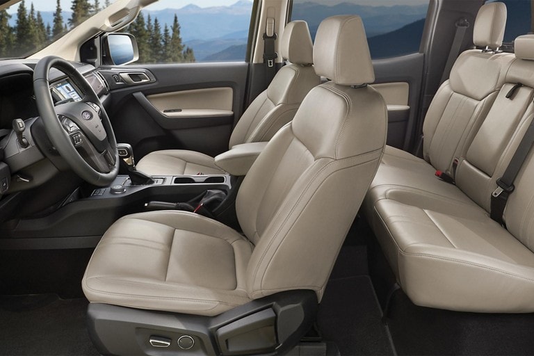 Interior shot of the 2023 Ford Ranger® showing the front bucket seats from a side view