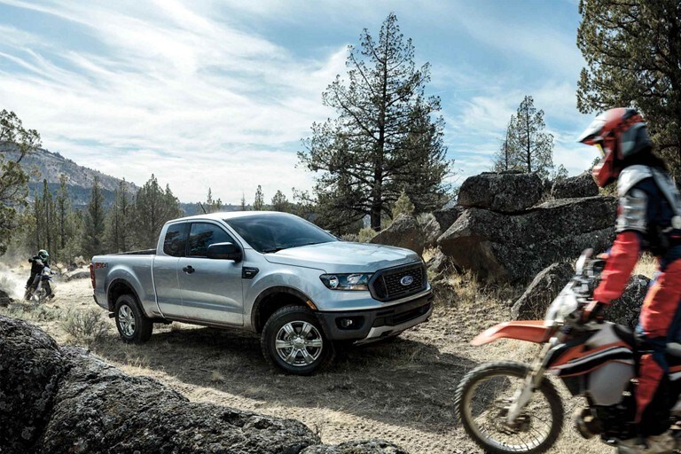 2023 Ford Ranger® STX Appearance Package in Iconic Silver driving up a dirt road in the mountains