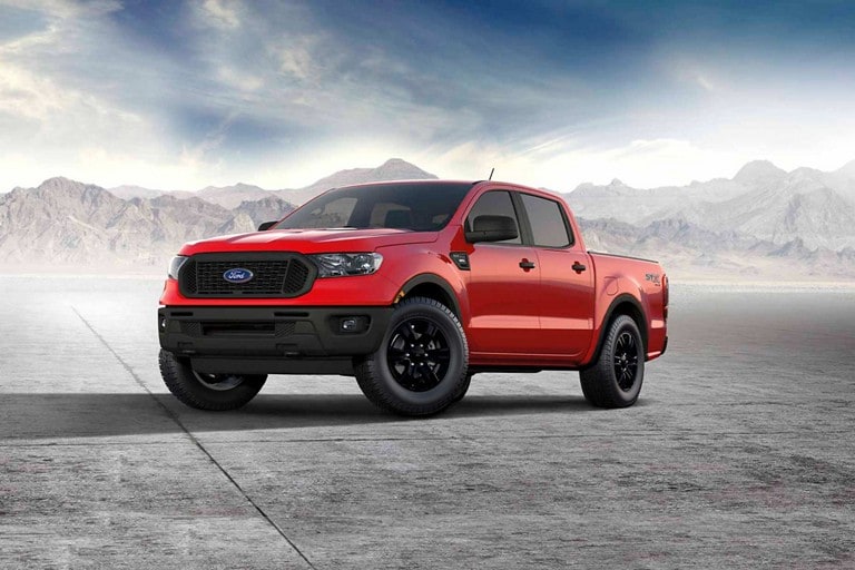 2023 Ford Ranger® STX Special Edition Package in race red parked in front of the mountains