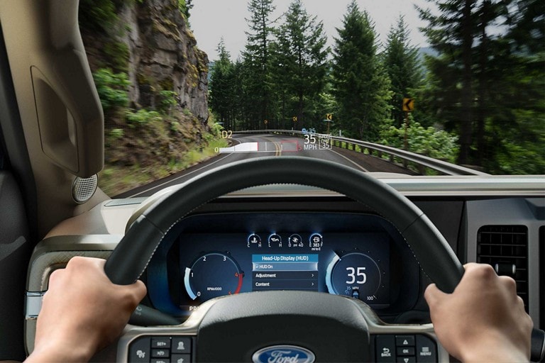 Driver's perspective showing the head-up display projected onto the windshield