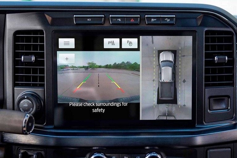 Centre display screen highlighting the rear view camera image