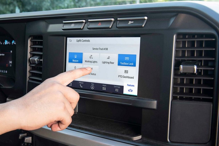 Person using the centre touchscreen