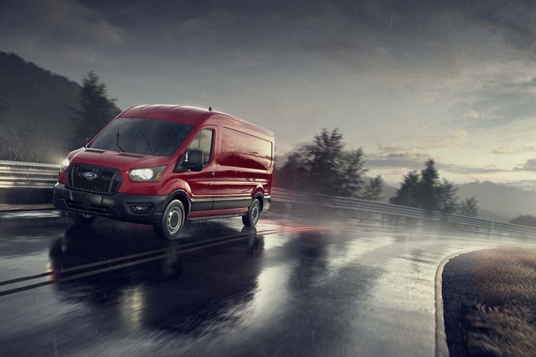 2023 Ford Transit® van being driven on a wet road