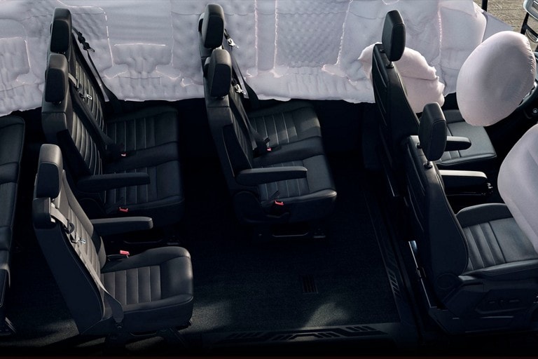 Cutaway view of interior showing inflated airbags