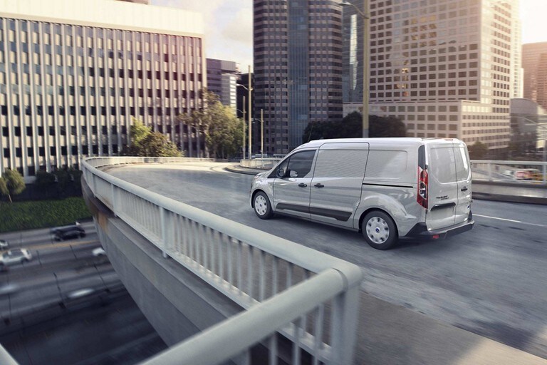 2023 Ford Transit Connect Cargo Van in Silver on road with standard side wind stabilization system