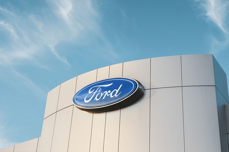The exterior facia of a modern Ford dealership