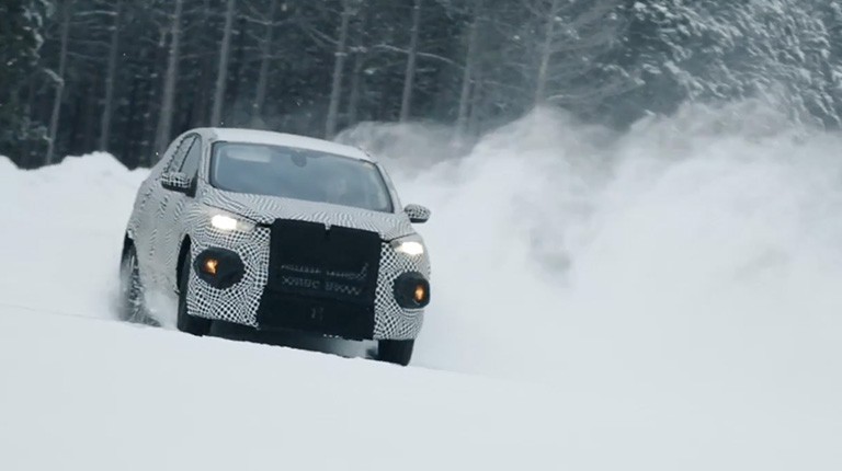 Ford EV driving in snow.