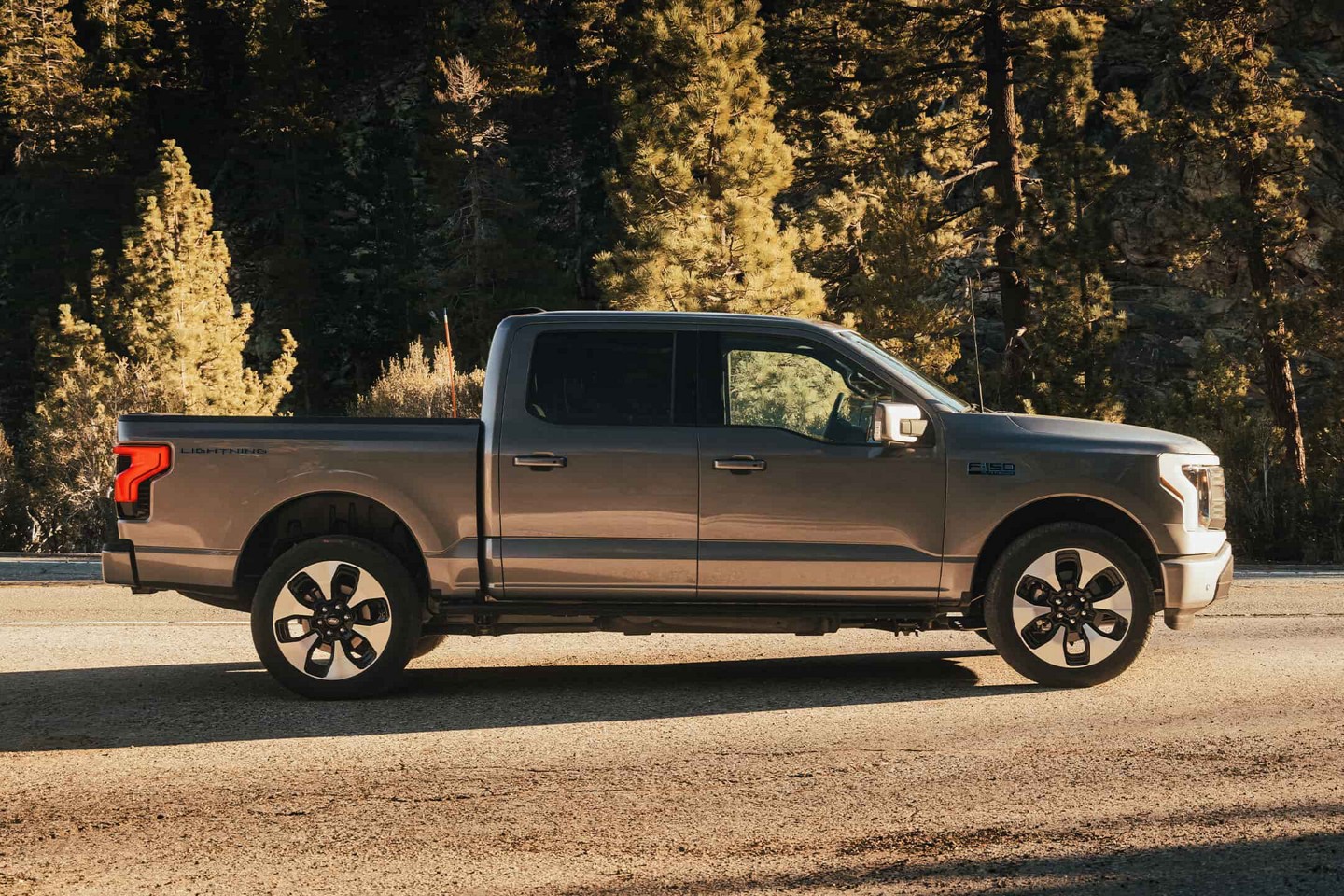 F-150 Lightning parked on a rural road.