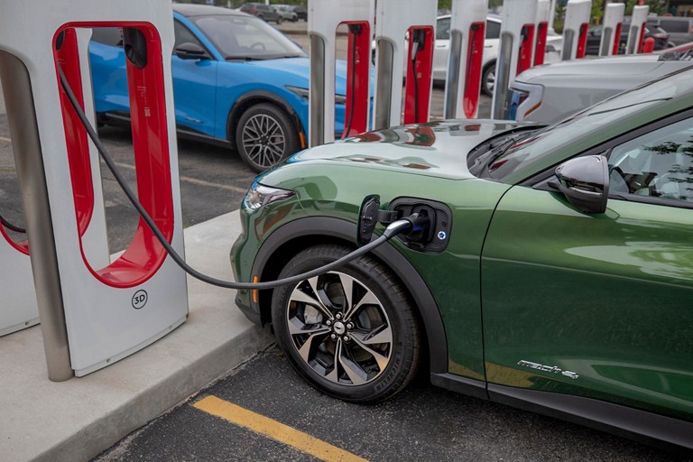 Row of Tesla Superchargers.