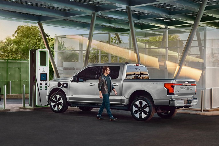 F-150 Lightning parked at a public charging station.