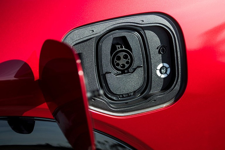 Image of an open charging port showing the recepticle